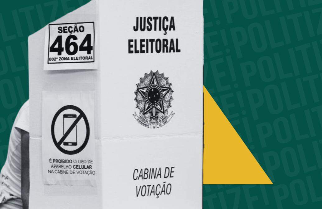 a imagem mostra uma cabine de votação pelo lado de fora. é possícel ver a aviso que proíbe o uso do celular.